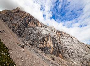 Ai piedi della smisurata Parete Sud della Marmolada.